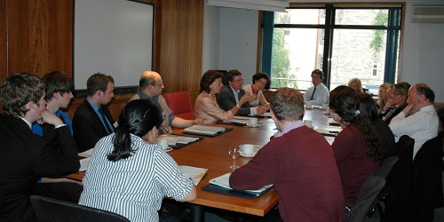 Intense conversation around the table, with StartupCafe taking over this corner